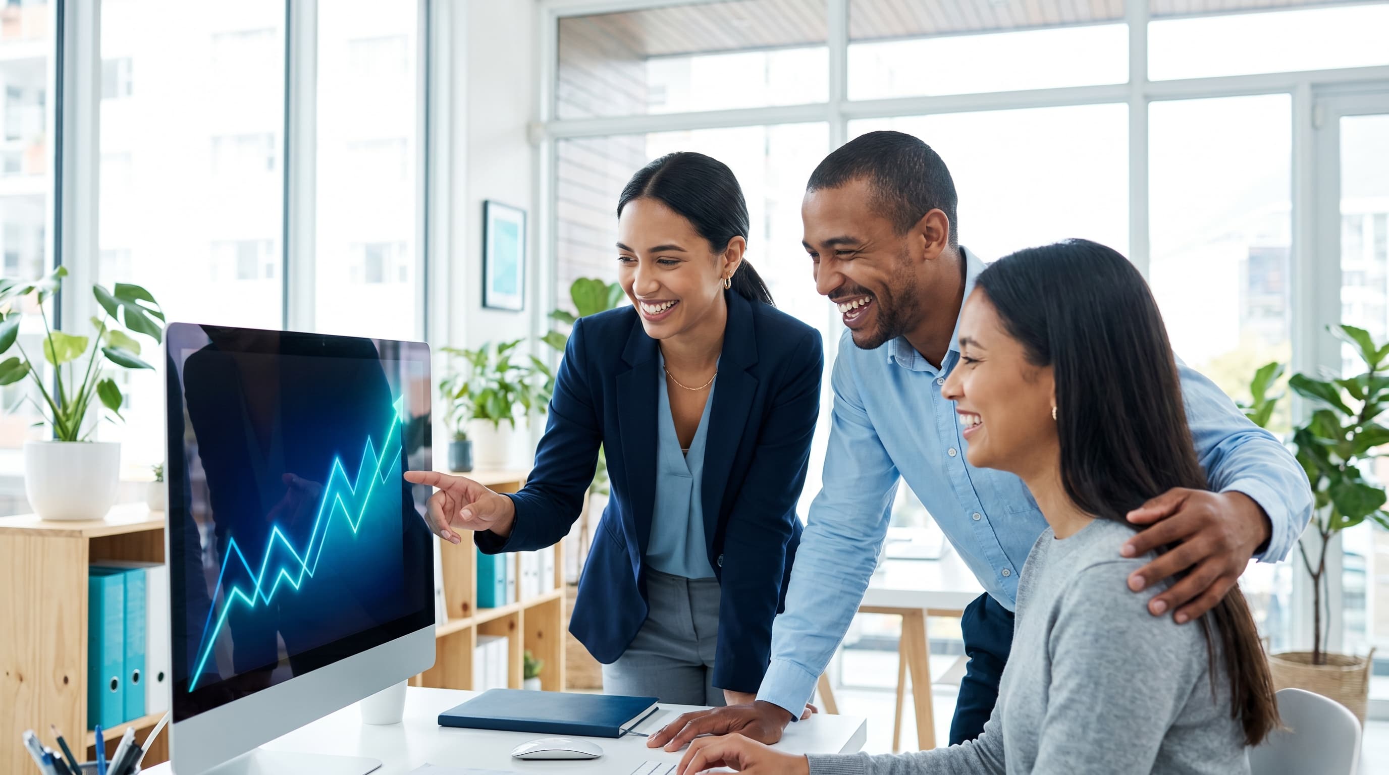 A small team watching their business grow on a dashboard